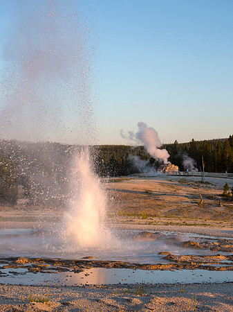 Sawmill Geyser with Castle Geyser in steam phase - Upper Geyser Basin - Yellowstone National Park