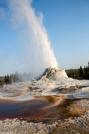 Castle Geyser eruption reflected in water - Upper Geyser Basin - Yellowstone National Park